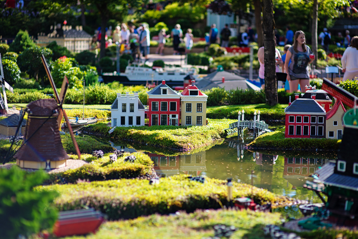 Miniature Dutch canal houses and a windmill at Miniland, Legoland Billund, Denmark.