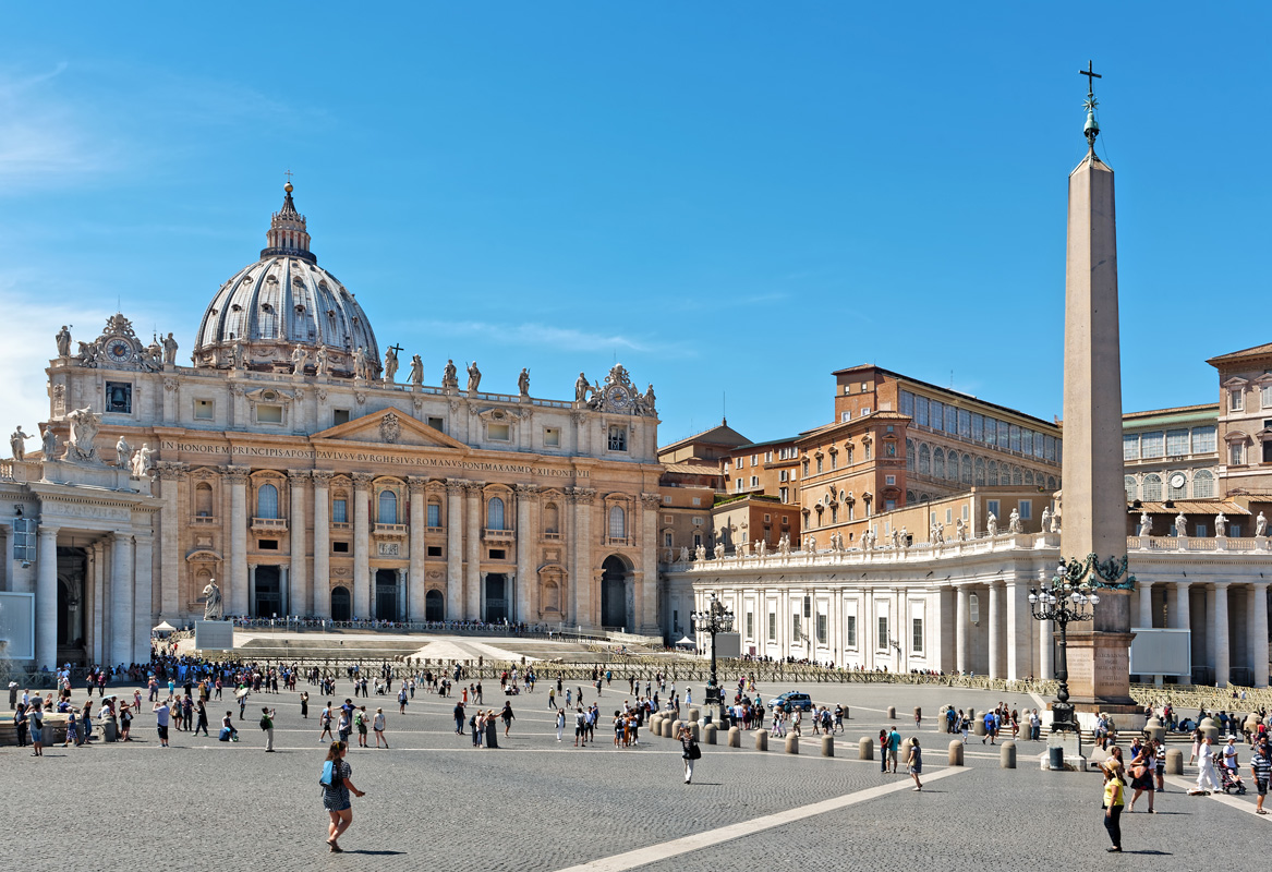 Many tourists walking around on St.Marks square outside of St.Paul's cathedral St Peter's Square Egyptian Obelisk