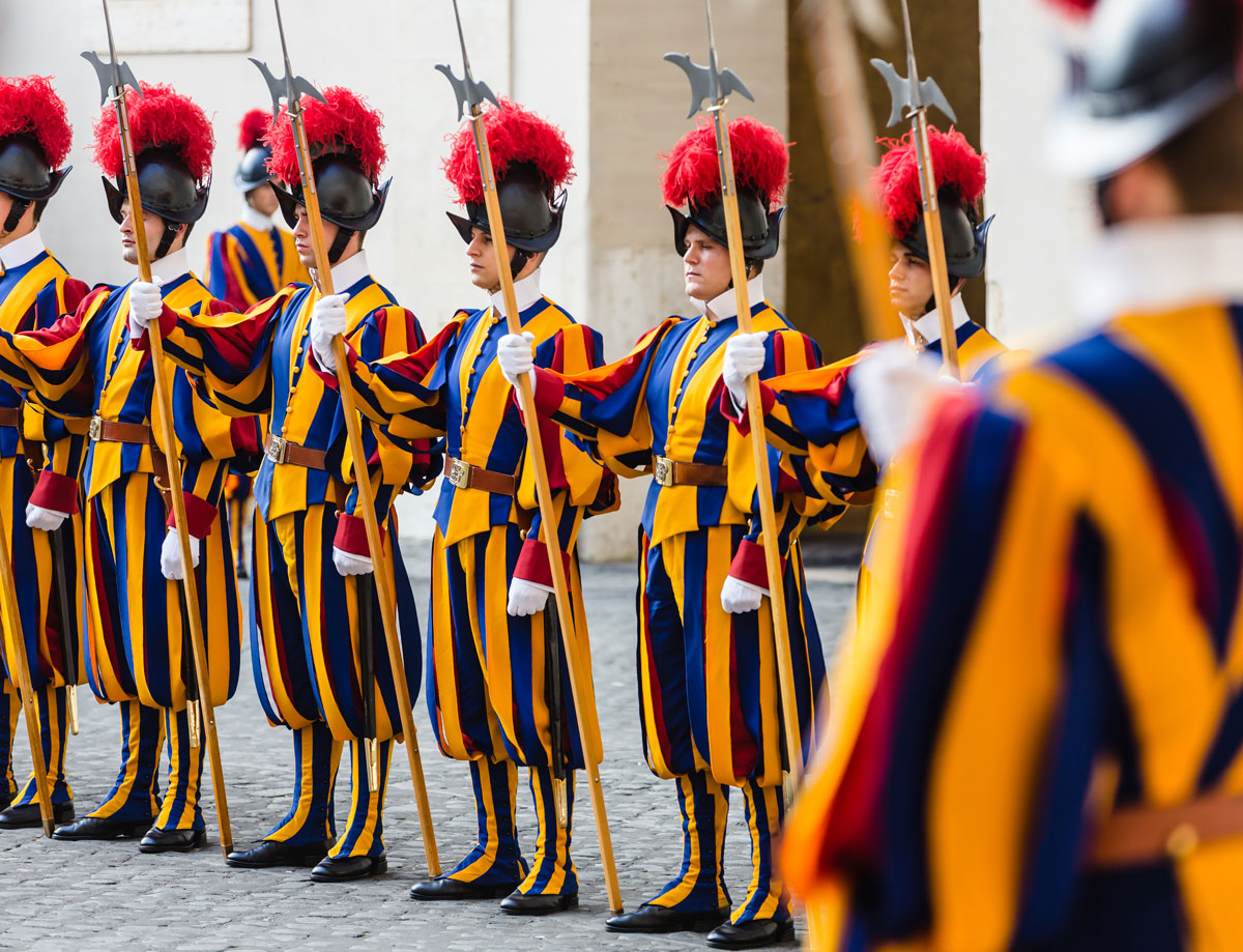The Swiss Guards standing guard in colourful uniform outside the St. Pauls cathedral in Rome. Swiss Guard Vatican