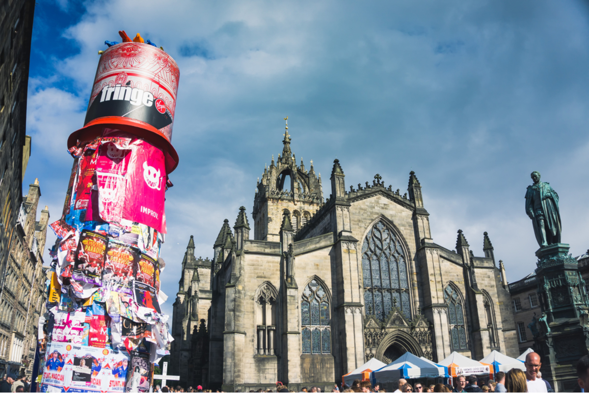 Posters for Edinburgh Fringe shows in front of St Giles Cathedral in Edinburgh Scotland