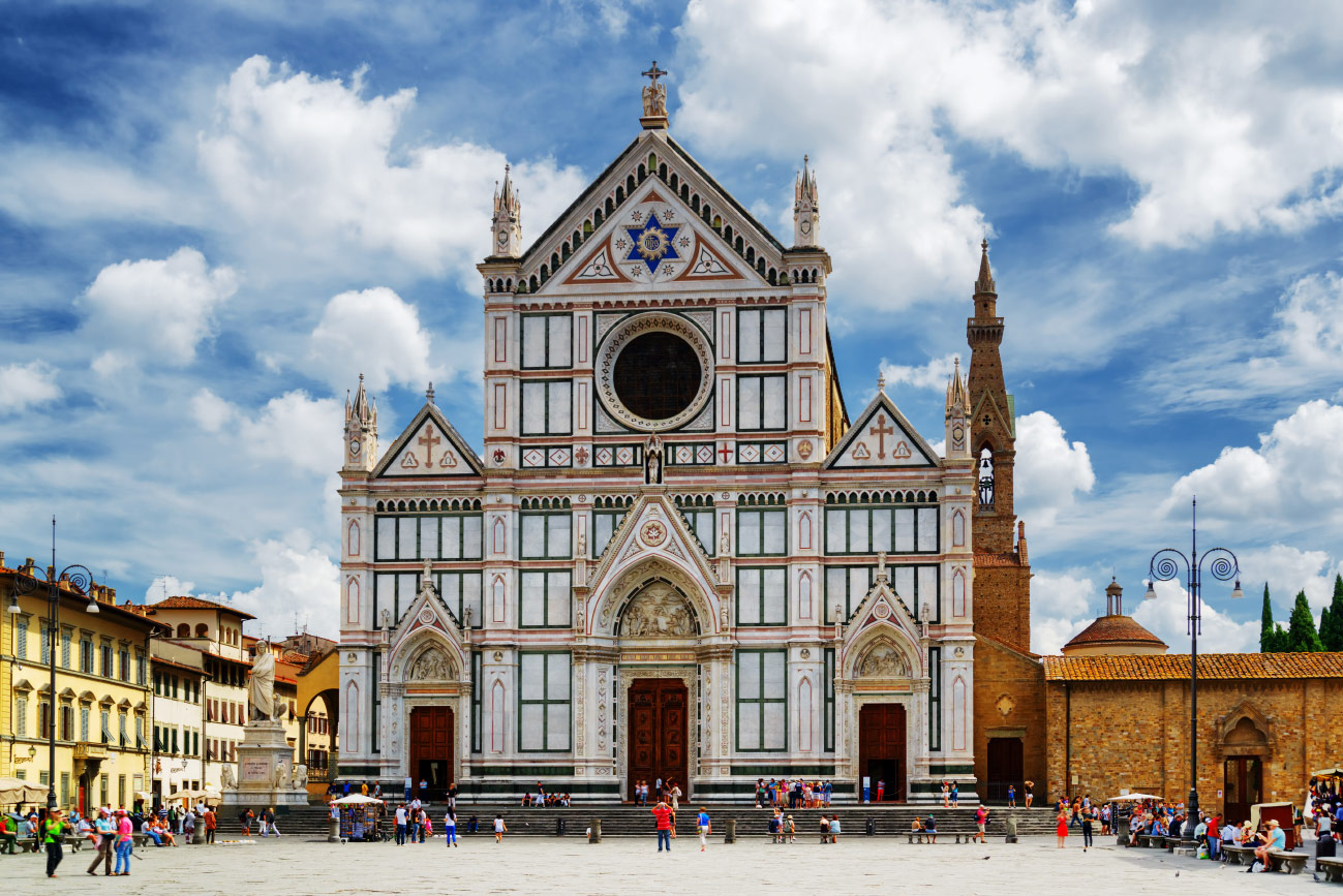 Gothic marble facade of the Basilica of Santa Croce on its piazza in Florence, Italy