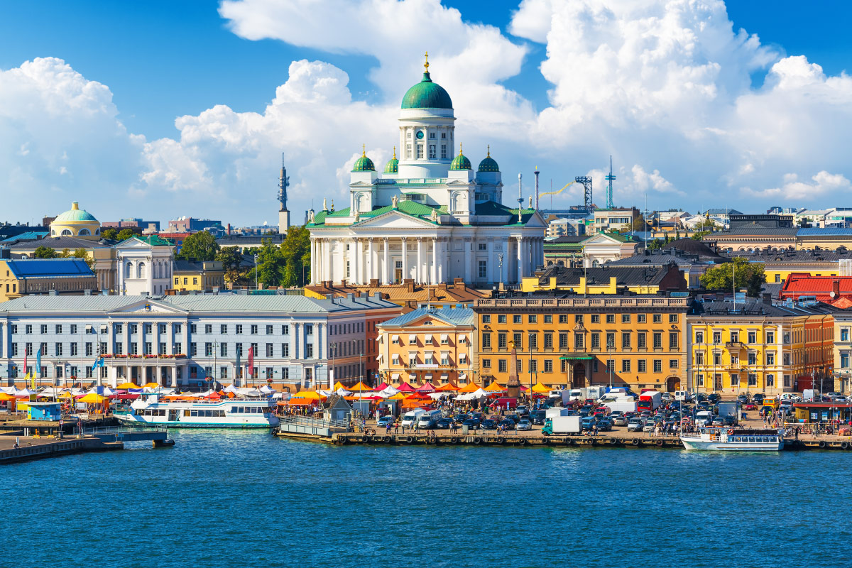Helsinki Cathedral above the harbour and Market Square stalls in Helsinki, Finland