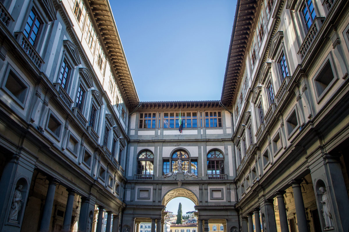 Uffizi Gallery courtyard framed by its long Renaissance arcades in Florence, Italy