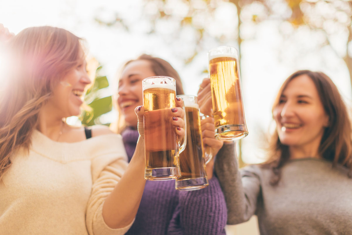 A group of friends celebrating with some Irish beer group travel