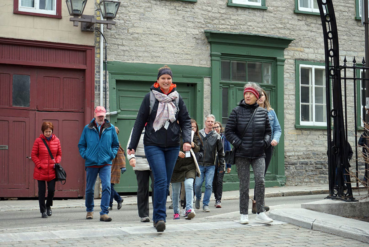 Nomad Quebec Walking Tours owner Marie leads a tour through the historic streets of Old Quebec