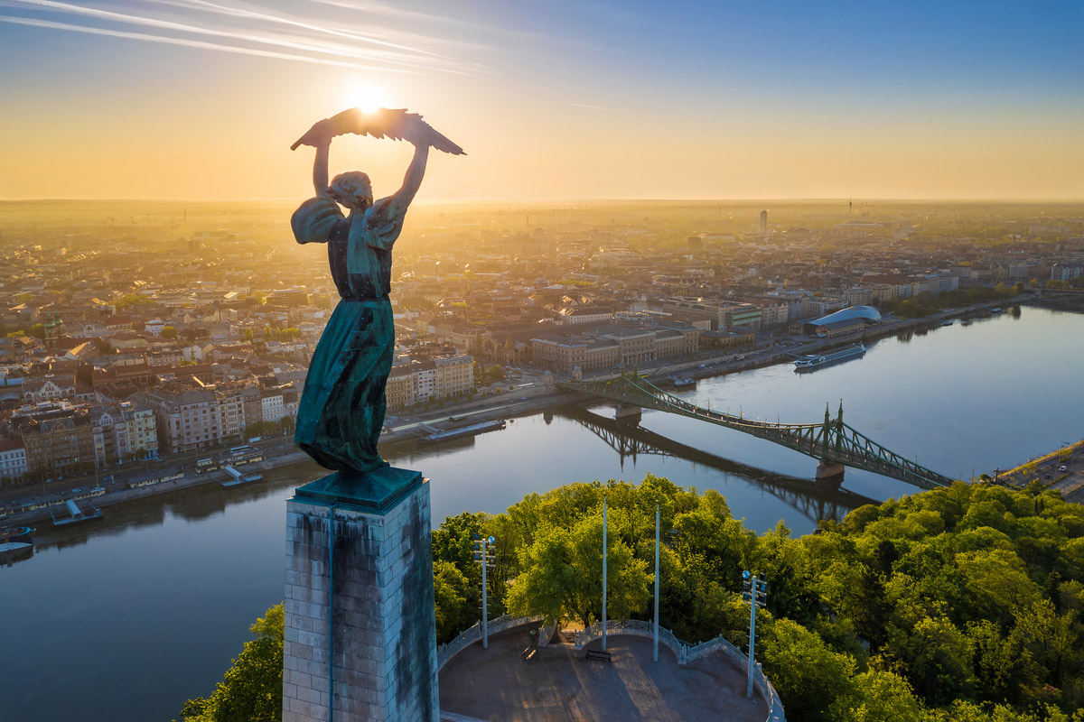 Aerial view of the beautiful Hungarian Statue of Liberty with Liberty Bridge and skyline of Budapest