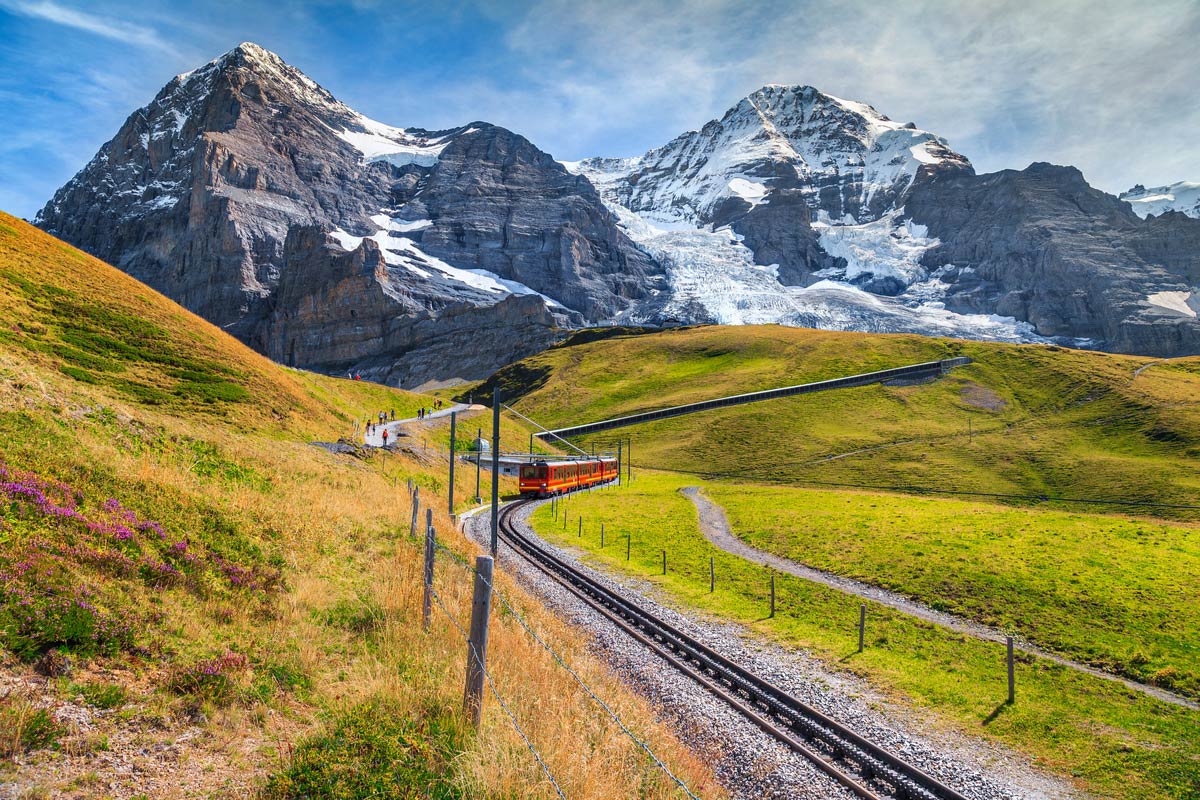 Famous electric red tourist train coming down from the Jungfraujoch station