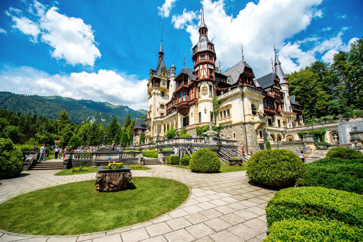 Beautiful Peles castle and ornamental garden in Sinaia landmark of Carpathian mountains in Europe