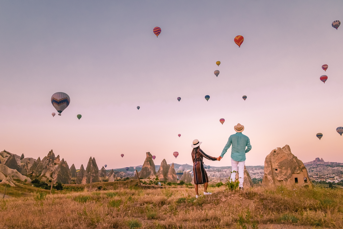 Couple watch hot air balloons Cappadocia Turkey Valentine's Day