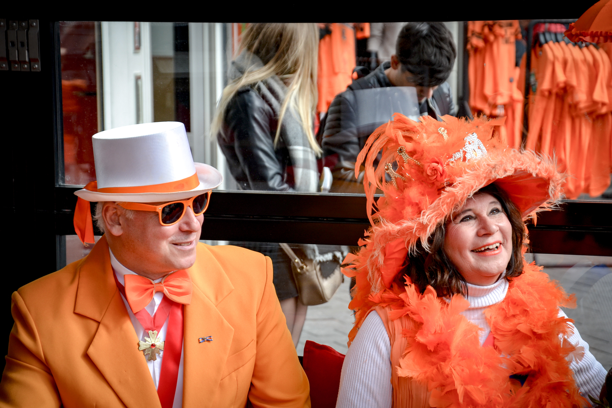 Couple dressed in orange King's Day