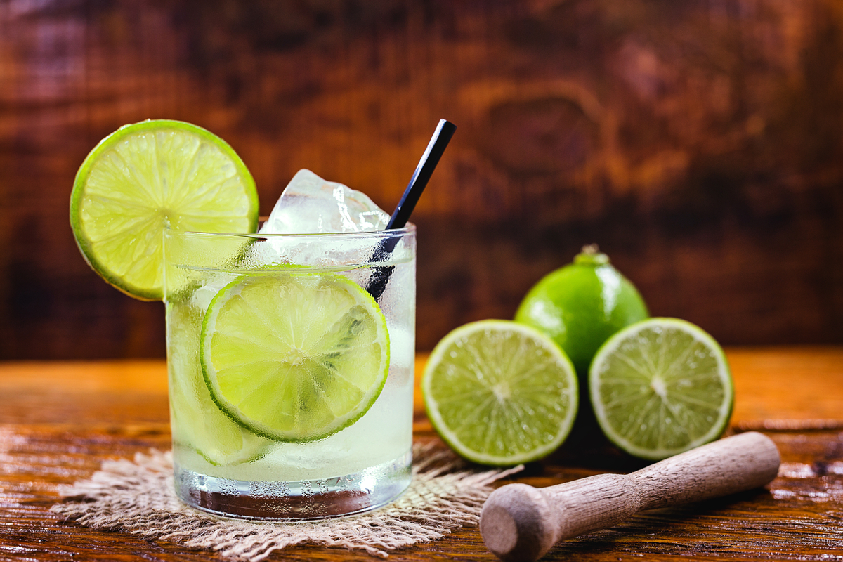 Caipirinha on table with fresh lime cocktails