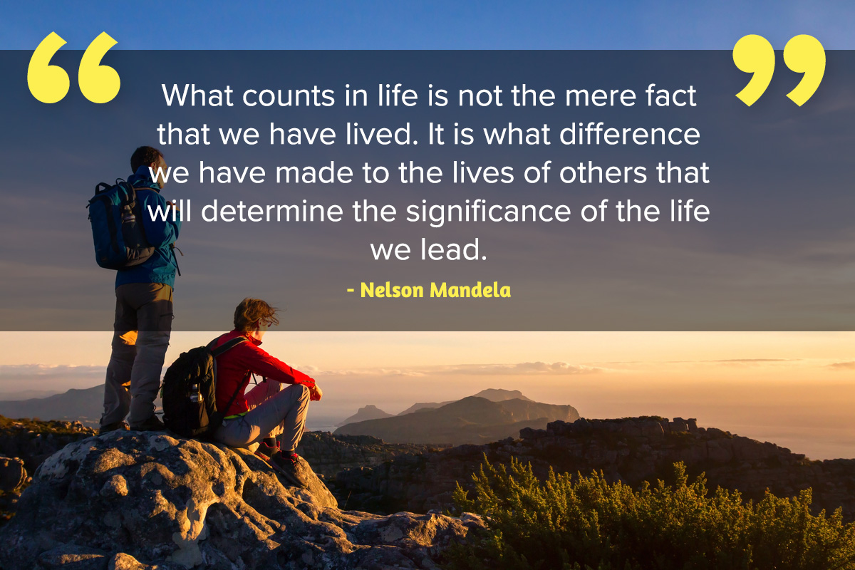Two men hiking and Inspirational quote Nelson Mandela Day