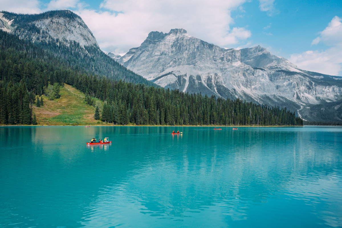 Friends kayak on Emerald Lake in Canada, World Kindness Day