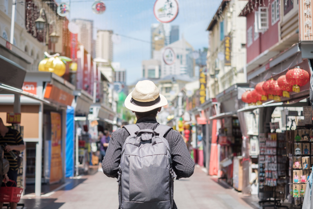 Male solo traveller viewing sights, 2023 trends